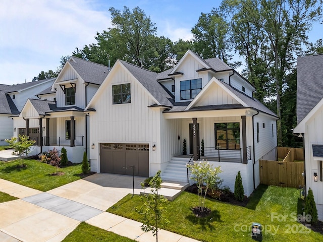 3945 Plainview Rd, Charlotte, NC 28208 - modern farmhouse style home with board and batten siding, an attached garage, covered porch, roof with shingles, and driveway
