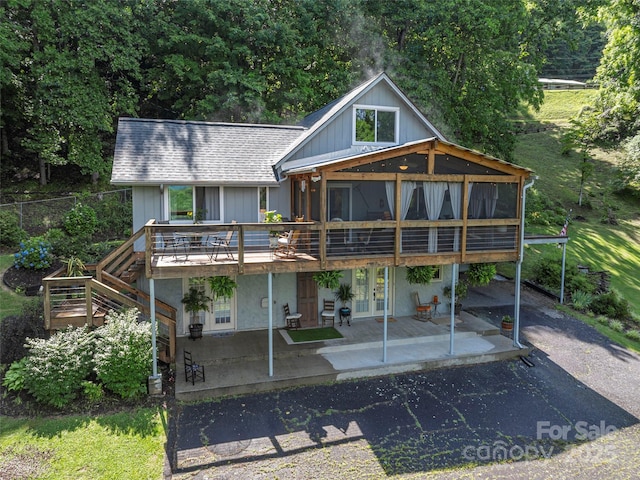 1411 Kitchens Branch Rd, Sylva, NC 28779 - rear view of property with a patio, a deck, roof with shingles, french doors, and asphalt driveway