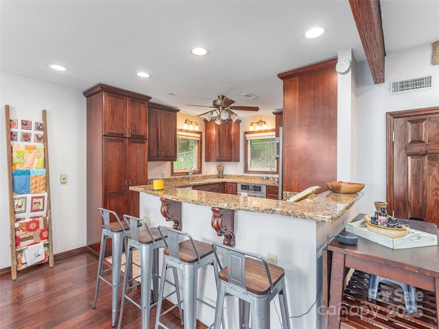 1411 Kitchens Branch Rd, Sylva, NC 28779 - kitchen featuring dark wood-style floors, recessed lighting, light stone counters, a peninsula, and ceiling fan