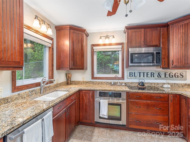 1411 Kitchens Branch Rd, Sylva, NC 28779 - kitchen featuring appliances with stainless steel finishes, ceiling fan, and light stone countertops