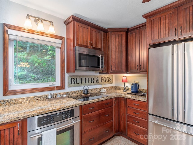 1411 Kitchens Branch Rd, Sylva, NC 28779 - kitchen featuring stainless steel appliances, light stone countertops, and light tile patterned floors