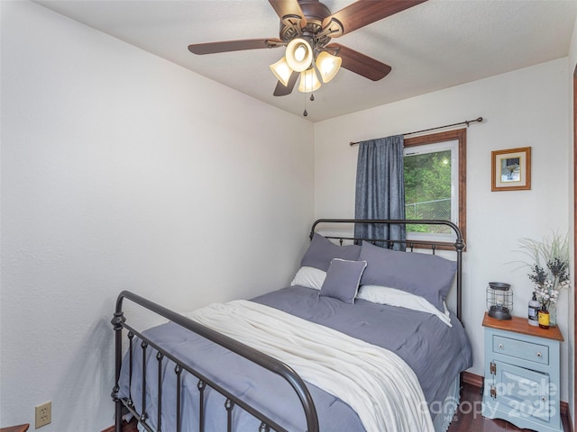 1411 Kitchens Branch Rd, Sylva, NC 28779 - bedroom with wood finished floors and ceiling fan