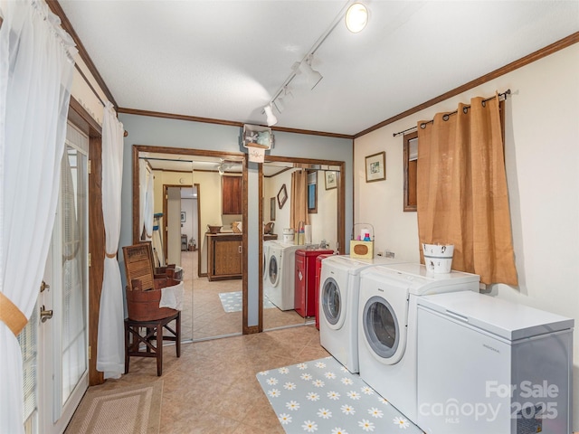 1411 Kitchens Branch Rd, Sylva, NC 28779 - laundry area featuring independent washer and dryer, cabinet space, crown molding, and light tile patterned floors