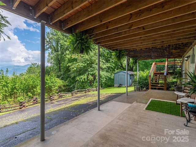 1411 Kitchens Branch Rd, Sylva, NC 28779 - view of patio / terrace featuring a shed and stairs