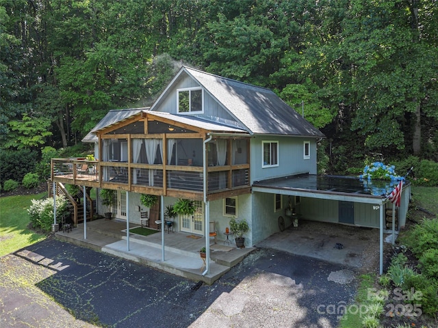 1411 Kitchens Branch Rd, Sylva, NC 28779 - view of front of home with asphalt driveway, french doors, a wooden deck, stairs, and a view of trees