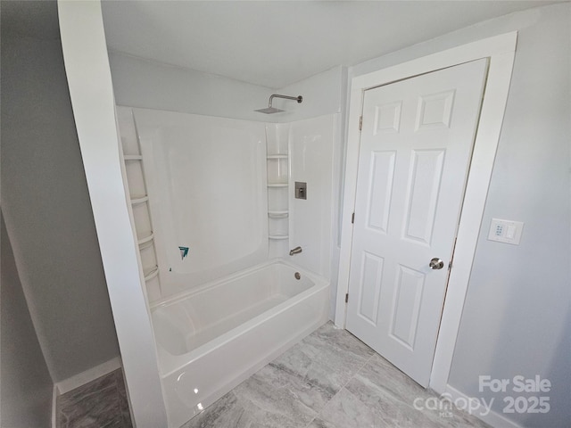1704 16th St NE, Hickory, NC 28601 - bathroom featuring bathing tub / shower combination and marble look tiles
