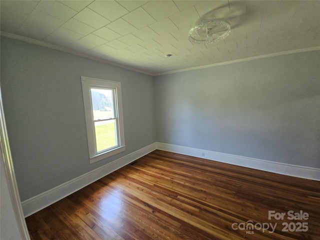1704 16th St NE, Hickory, NC 28601 - empty room with crown molding and dark wood-style floors