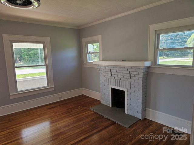 1704 16th St NE, Hickory, NC 28601 - unfurnished living room with dark wood-type flooring, a brick fireplace, and ornamental molding