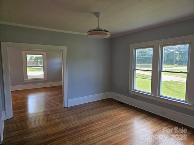 1704 16th St NE, Hickory, NC 28601 - spare room featuring plenty of natural light, hardwood / wood-style floors, and crown molding