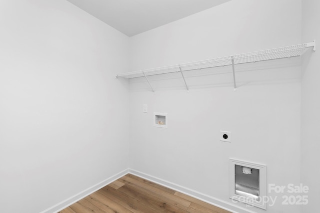 4474 Pebblebrook Cir SW, Concord, NC 28027 - laundry room featuring hookup for a washing machine, wood finished floors, and hookup for an electric dryer