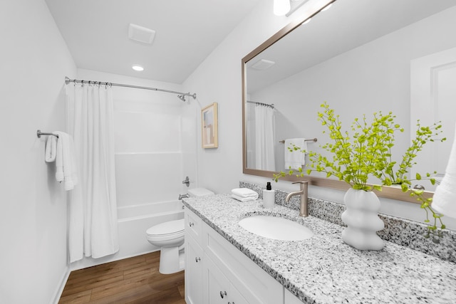 4474 Pebblebrook Cir SW, Concord, NC 28027 - bathroom featuring vanity, shower / bath combo, wood finished floors, and recessed lighting