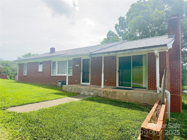 30 Cypress Rd, Marion, NC 28752 - rear view of property featuring a chimney, brick siding, and a lawn