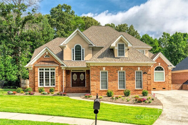 10405 Lady Grace Ln, Charlotte, NC 28270 - view of front of property with roof with shingles, brick siding, and driveway