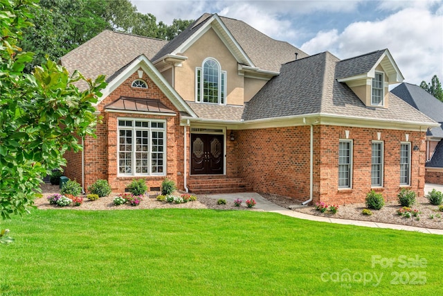 10405 Lady Grace Ln, Charlotte, NC 28270 - view of front facade featuring roof with shingles, a front yard, stucco siding, and brick siding