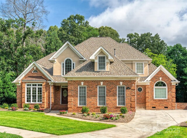 10405 Lady Grace Ln, Charlotte, NC 28270 - view of front of house with a shingled roof, a front lawn, brick siding, and crawl space