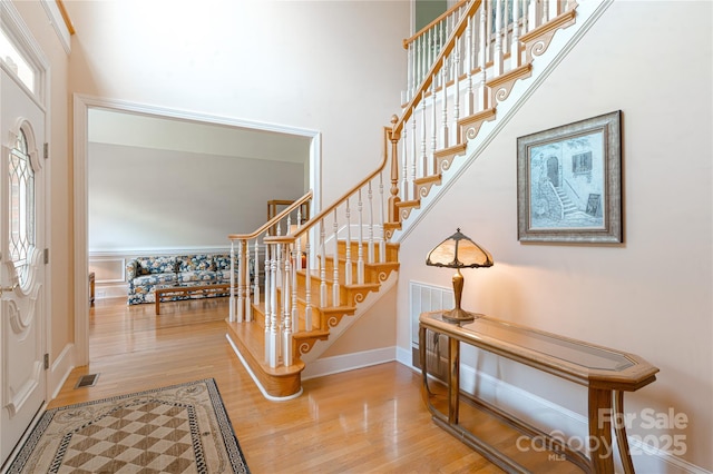 10405 Lady Grace Ln, Charlotte, NC 28270 - entrance foyer featuring wood finished floors, stairs, and a high ceiling