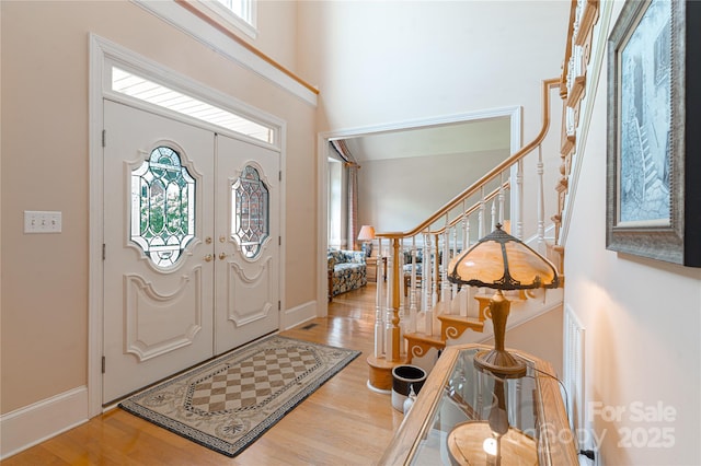 10405 Lady Grace Ln, Charlotte, NC 28270 - entrance foyer with stairs, wood finished floors, and a high ceiling