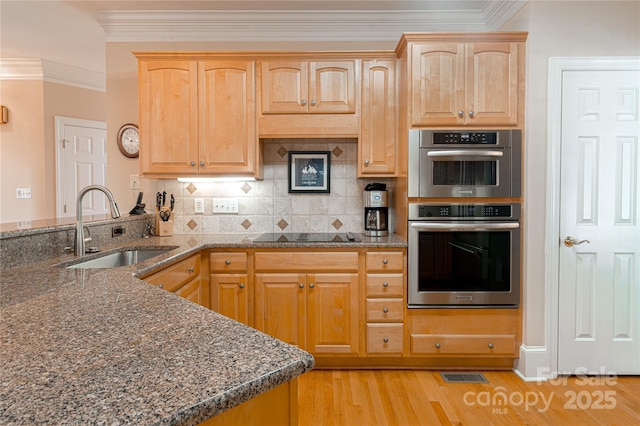10405 Lady Grace Ln, Charlotte, NC 28270 - kitchen with ornamental molding, dark stone countertops, light wood-style floors, backsplash, and black electric cooktop
