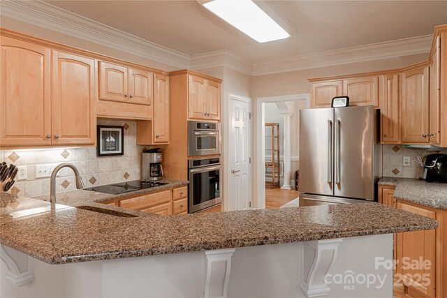10405 Lady Grace Ln, Charlotte, NC 28270 - kitchen featuring appliances with stainless steel finishes, light brown cabinetry, stone counters, and crown molding