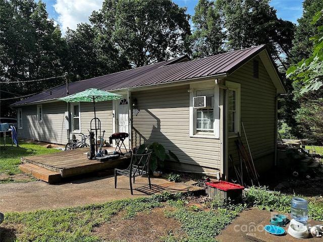 1041 Tomlinson Loop, Connelly Springs, NC 28612 - rear view of property with a deck, a metal roof, and a standing seam roof