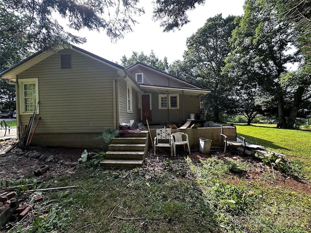 1041 Tomlinson Loop, Connelly Springs, NC 28612 - rear view of house featuring a lawn