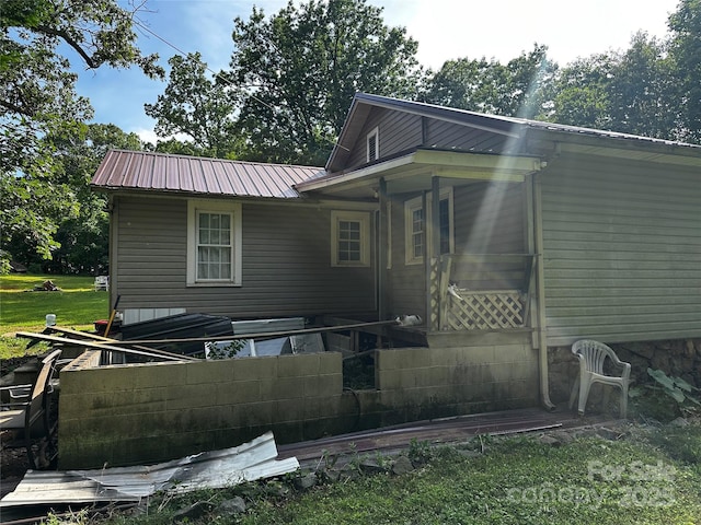 1041 Tomlinson Loop, Connelly Springs, NC 28612 - back of property featuring a metal roof and a lawn