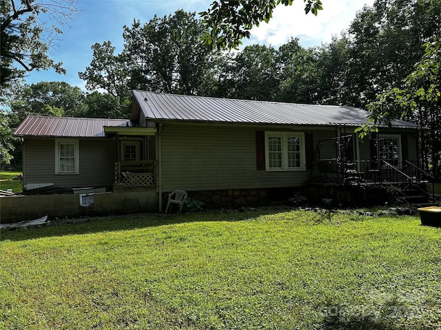 1041 Tomlinson Loop, Connelly Springs, NC 28612 - view of front of home featuring a front lawn, a metal roof, and a porch