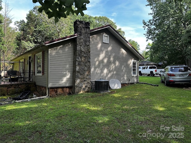 1041 Tomlinson Loop, Connelly Springs, NC 28612 - view of home's exterior featuring a central air condition unit and a yard