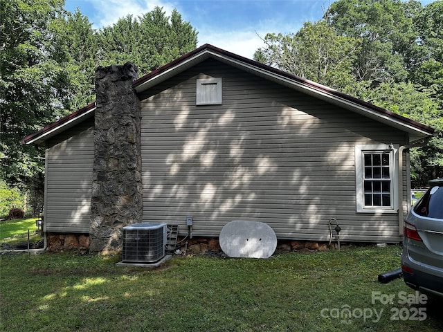 1041 Tomlinson Loop, Connelly Springs, NC 28612 - view of side of home featuring a lawn and a chimney