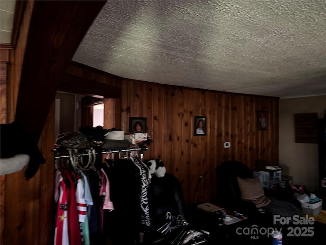 1041 Tomlinson Loop, Connelly Springs, NC 28612 - living area featuring a textured ceiling and wooden walls