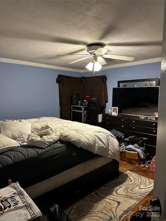 1041 Tomlinson Loop, Connelly Springs, NC 28612 - bedroom featuring a textured ceiling, wood finished floors, and ceiling fan