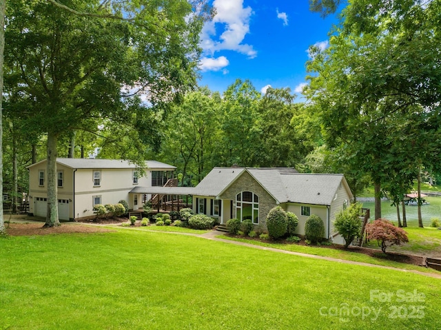 698 Normandy Rd, Mooresville, NC 28117 - view of front of property featuring a garage, a front lawn, and stone siding