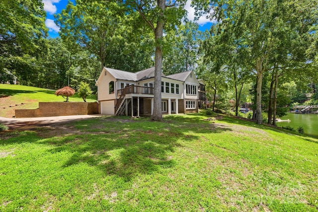 698 Normandy Rd, Mooresville, NC 28117 - rear view of property with an attached garage, a yard, a deck, and view of scattered trees
