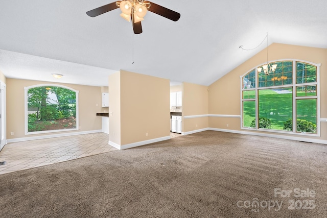 698 Normandy Rd, Mooresville, NC 28117 - unfurnished living room with carpet, ceiling fan, vaulted ceiling, and a chandelier