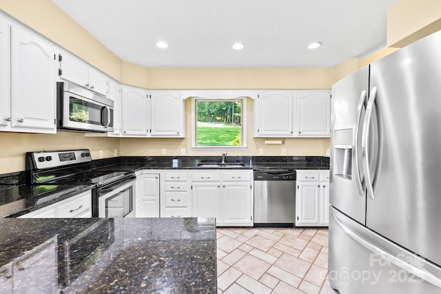 698 Normandy Rd, Mooresville, NC 28117 - kitchen with appliances with stainless steel finishes, white cabinetry, dark stone countertops, and recessed lighting
