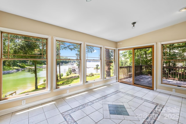 698 Normandy Rd, Mooresville, NC 28117 - unfurnished sunroom with a water view, healthy amount of natural light, lofted ceiling, and tile patterned flooring