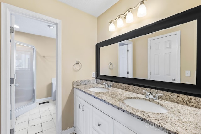 698 Normandy Rd, Mooresville, NC 28117 - full bathroom with a stall shower, double vanity, and tile patterned flooring
