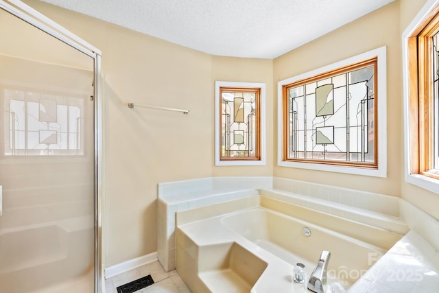 698 Normandy Rd, Mooresville, NC 28117 - full bath with a bath, a stall shower, tile patterned flooring, and a textured ceiling