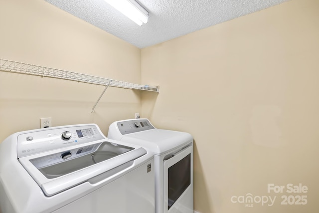 698 Normandy Rd, Mooresville, NC 28117 - laundry area featuring washing machine and clothes dryer and a textured ceiling