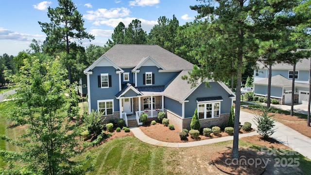 101 Cross Current Ln, Belmont, NC 28012 - view of front of house with a porch, stone siding, and driveway