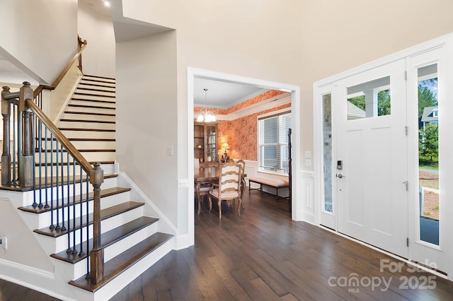 101 Cross Current Ln, Belmont, NC 28012 - foyer featuring dark wood finished floors, stairs, and a chandelier
