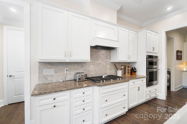 101 Cross Current Ln, Belmont, NC 28012 - kitchen with appliances with stainless steel finishes, crown molding, stone countertops, dark wood-style floors, and white cabinetry