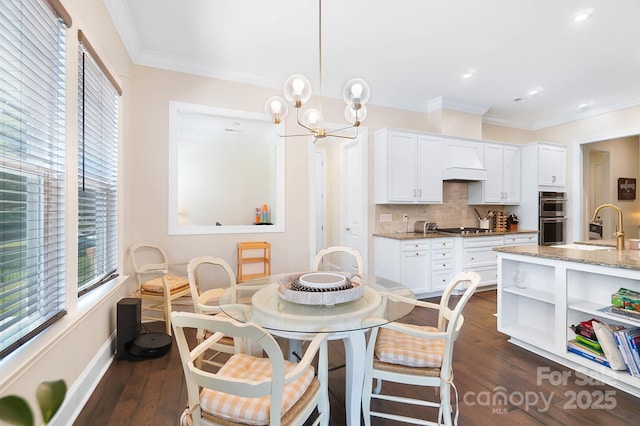 101 Cross Current Ln, Belmont, NC 28012 - dining area featuring healthy amount of natural light, crown molding, dark wood finished floors, a chandelier, and recessed lighting