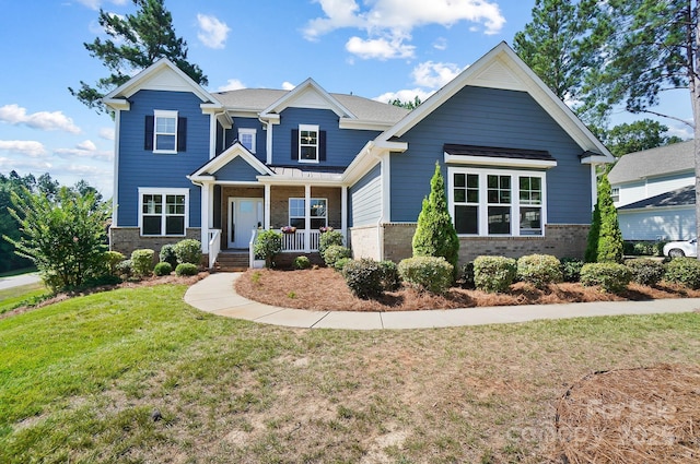 101 Cross Current Ln, Belmont, NC 28012 - craftsman-style house featuring covered porch, brick siding, and a front lawn