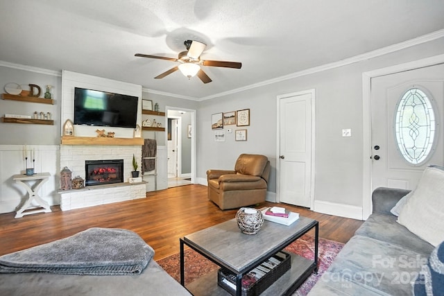 602 Unity St, Fort Mill, SC 29715 - living area featuring ceiling fan, wood finished floors, ornamental molding, and a large fireplace
