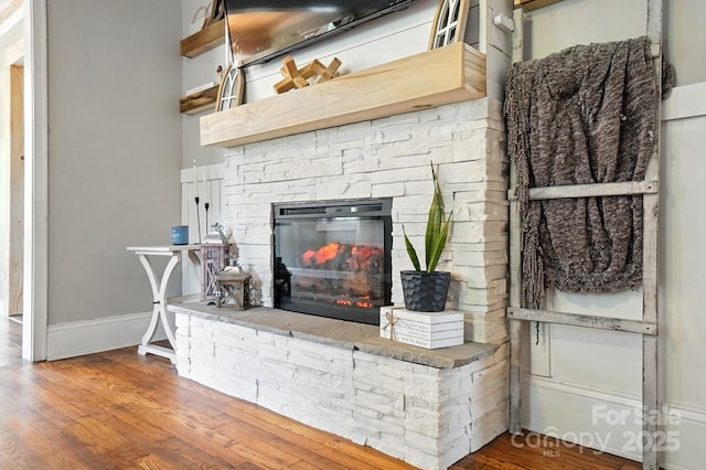 602 Unity St, Fort Mill, SC 29715 - detailed view of wood finished floors and a stone fireplace