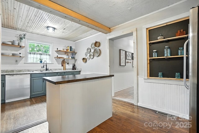 602 Unity St, Fort Mill, SC 29715 - kitchen with dishwashing machine, open shelves, dark wood-style flooring, beam ceiling, and a wainscoted wall