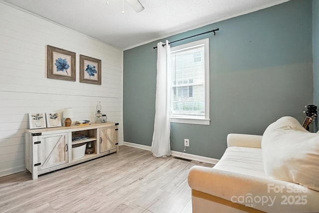 602 Unity St, Fort Mill, SC 29715 - living area featuring light wood finished floors and wood walls