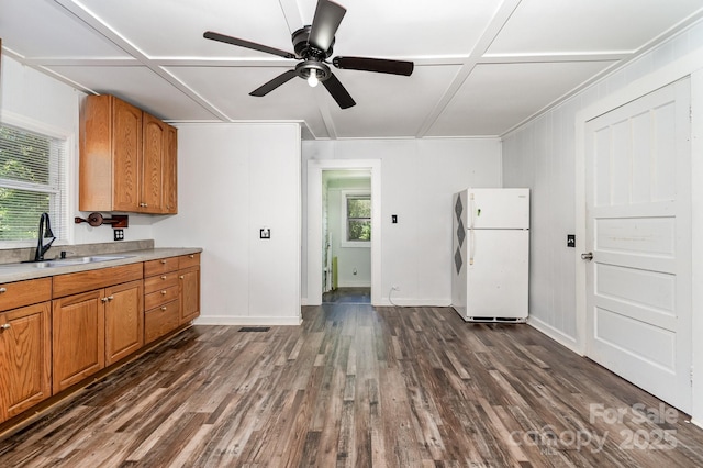 1224 Hollywood Ter, Albemarle, NC 28001 - kitchen with freestanding refrigerator, ceiling fan, dark wood-type flooring, light countertops, and brown cabinetry