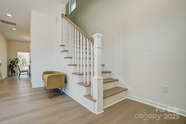 709 Catawba St, Lincolnton, NC 28092 - stairs featuring wood finished floors and recessed lighting